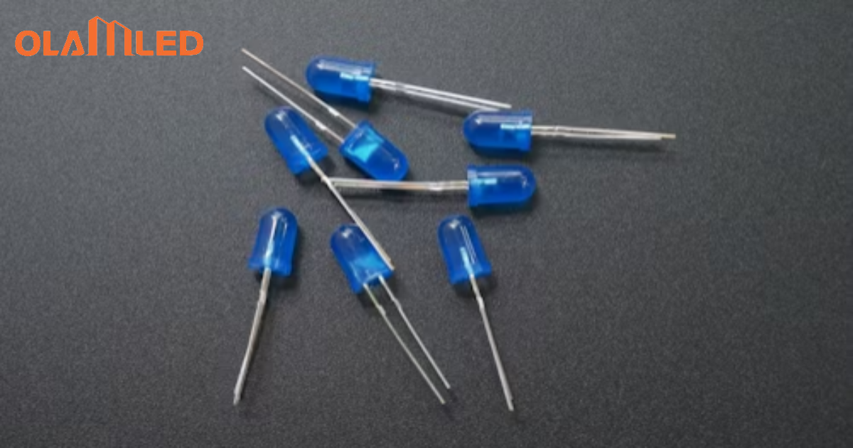 A group of glowing blue leds positioned on a black surface, highlighting their luminous quality in a dark setting.