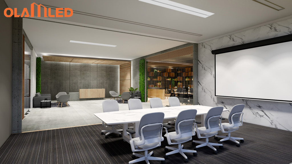 A modern conference room illuminated by office lights, equipped with a large screen and seating for participants.