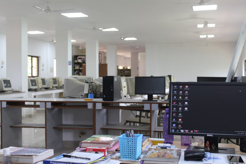 A workspace desk with a computer monitor and an led panel light, designed for productivity and efficiency.