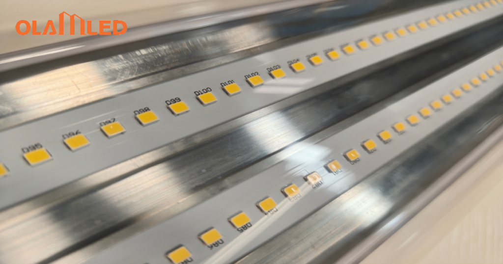 Close up image of a metal strip with bright yellow led light beads shining.