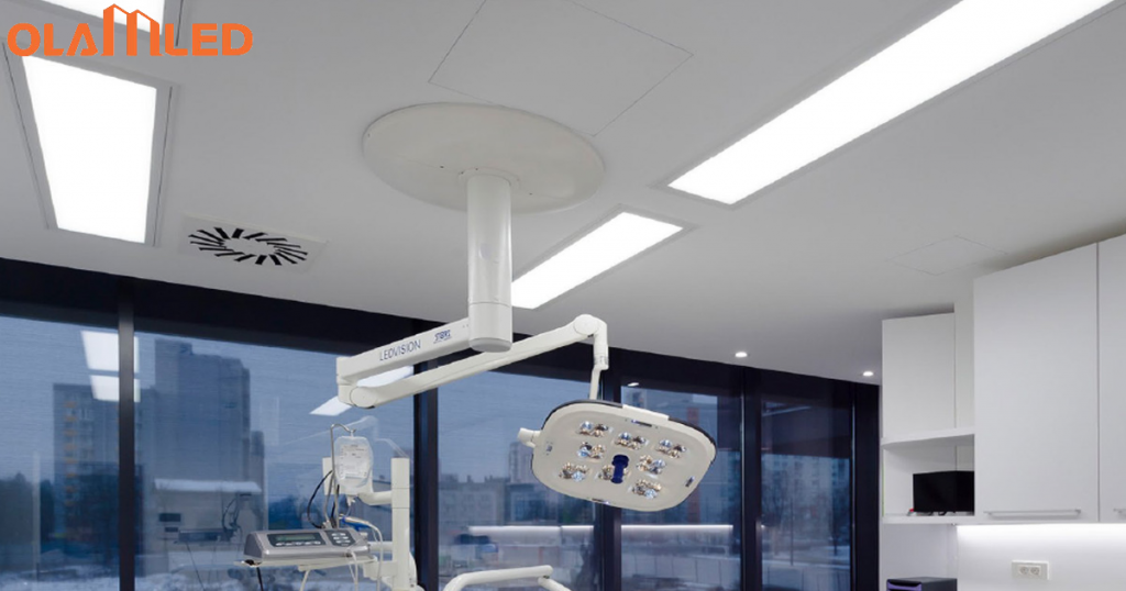 Interior of a dental office with a large window, a dental chair, and bright led cleanroom troffer lighting overhead