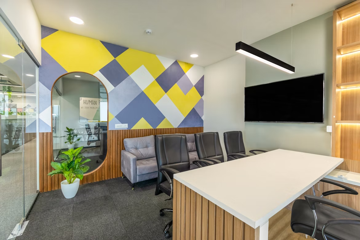 Brightly lit office interior with modern furnishings, creating a professional and comfortable workspace atmosphere.